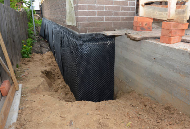 Happy homeowners after waterproofing job in Creola